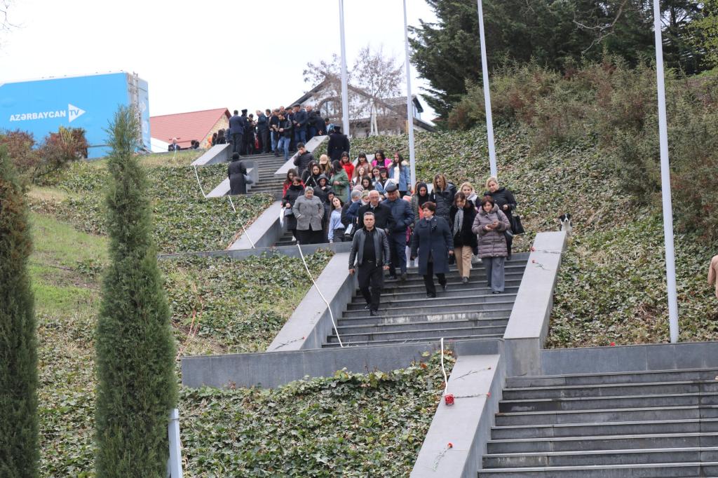 Mass flow continues to the Genocide Memorial Complex.