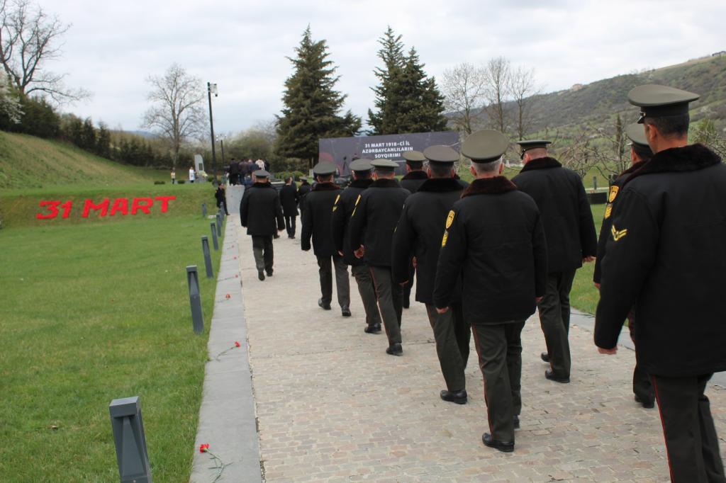 Mass flow continues to the Genocide Memorial Complex.