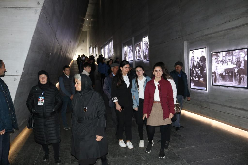 Mass flow continues to the Genocide Memorial Complex.