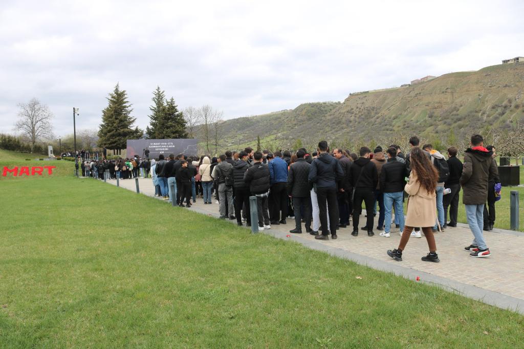 Mass flow continues to the Genocide Memorial Complex.