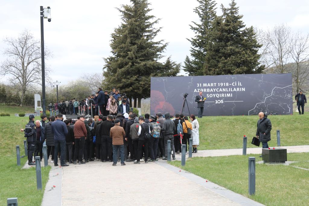 Mass flow continues to the Genocide Memorial Complex.
