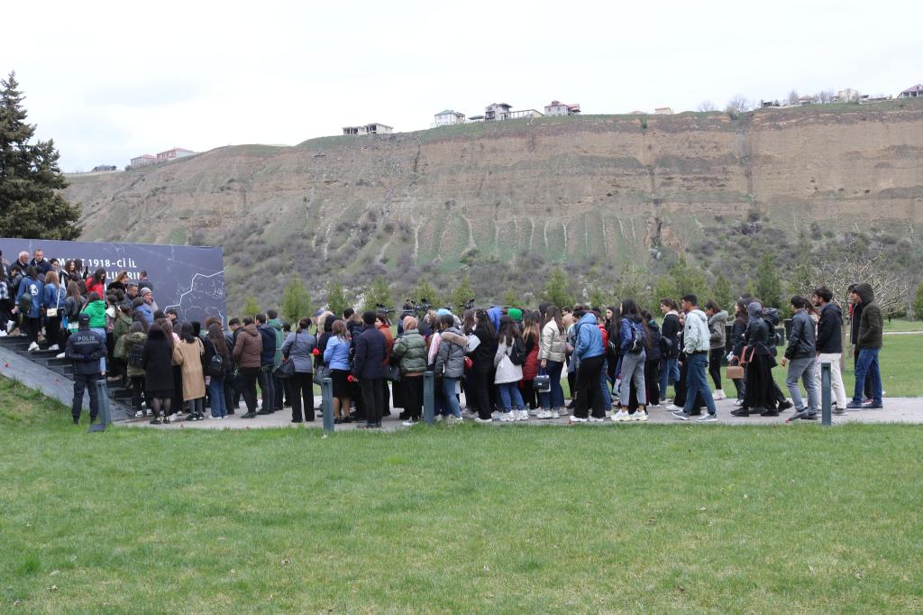 Mass flow continues to the Genocide Memorial Complex.