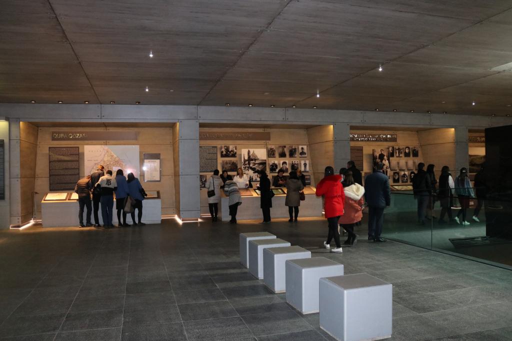 Mass flow continues to the Genocide Memorial Complex.