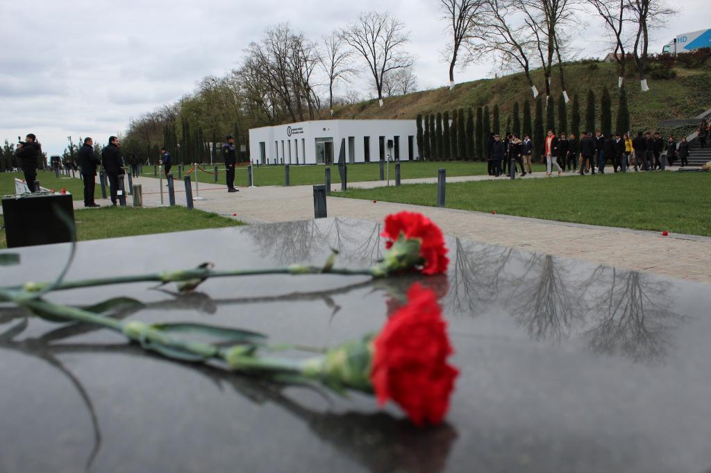Mass flow continues to the Genocide Memorial Complex.