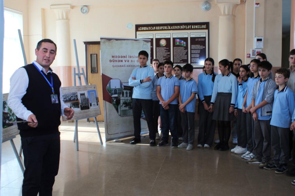 In Guba, with the initiative of the “Genocide Memorial Complex” and the support of the Guba-Khachmaz Regional Education Department, a photo exhibition has been launched in general education schools to showcase the past and present condition of monuments in the liberated territories of the Karabakh region.