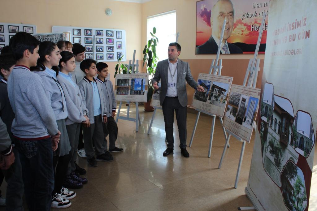 In Guba, with the initiative of the “Genocide Memorial Complex” and the support of the Guba-Khachmaz Regional Education Department, a photo exhibition has been launched in general education schools to showcase the past and present condition of monuments in the liberated territories of the Karabakh region.